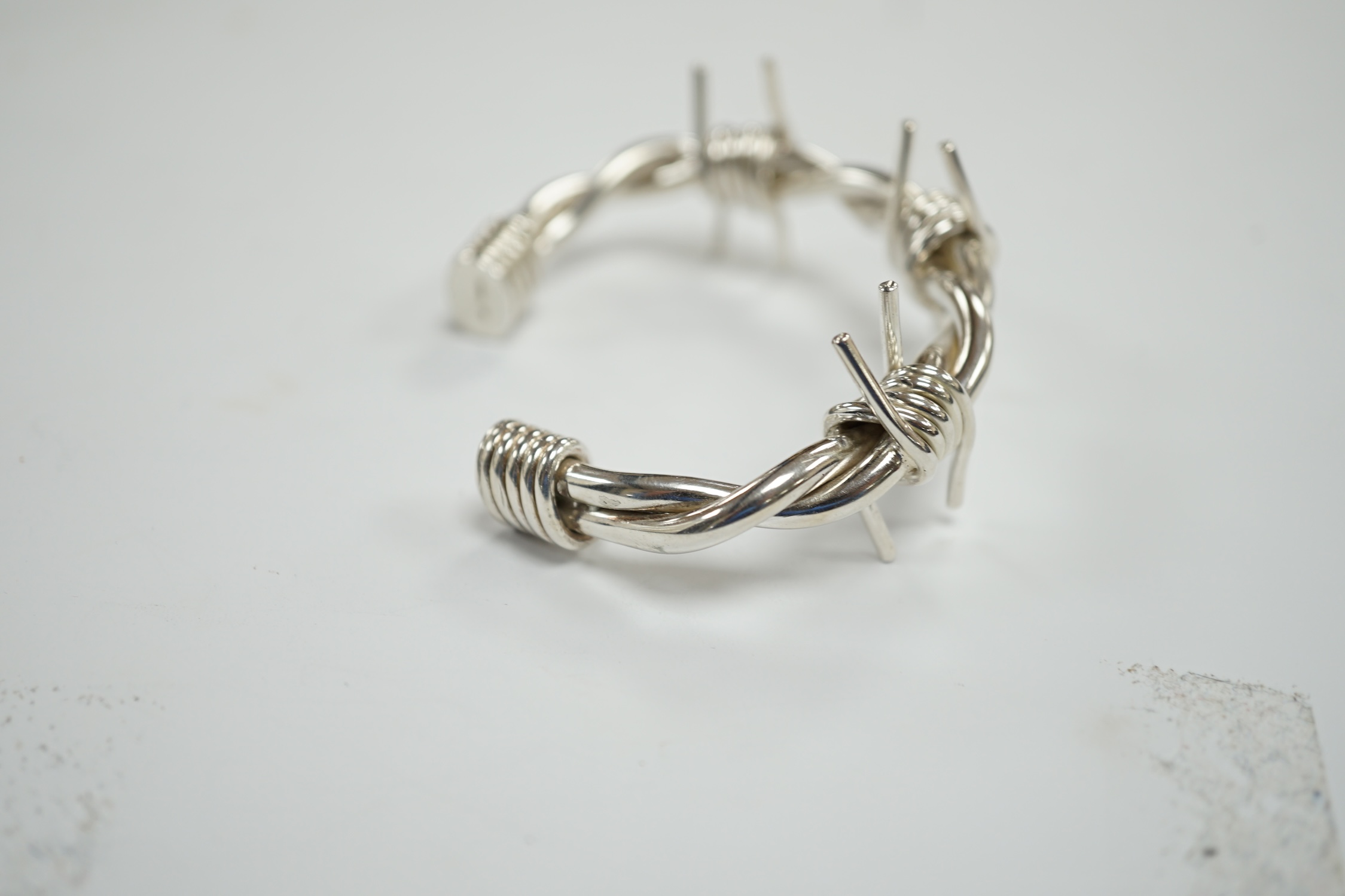 A modern silver 'barbed wire' open bangle, by M. Marlow, Edinburgh, 2006, overall width 83mm, 74 grams.